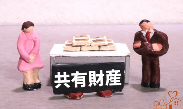 共有財産のロゴと人形